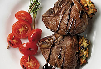 Lamb T-bone Chops with Mediterranean Stuffing and Rosemary Spiked Tomatoes