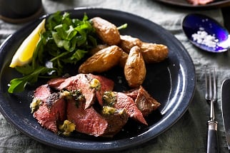Grilled Aussie flat iron steaks with anchovy and thyme butter